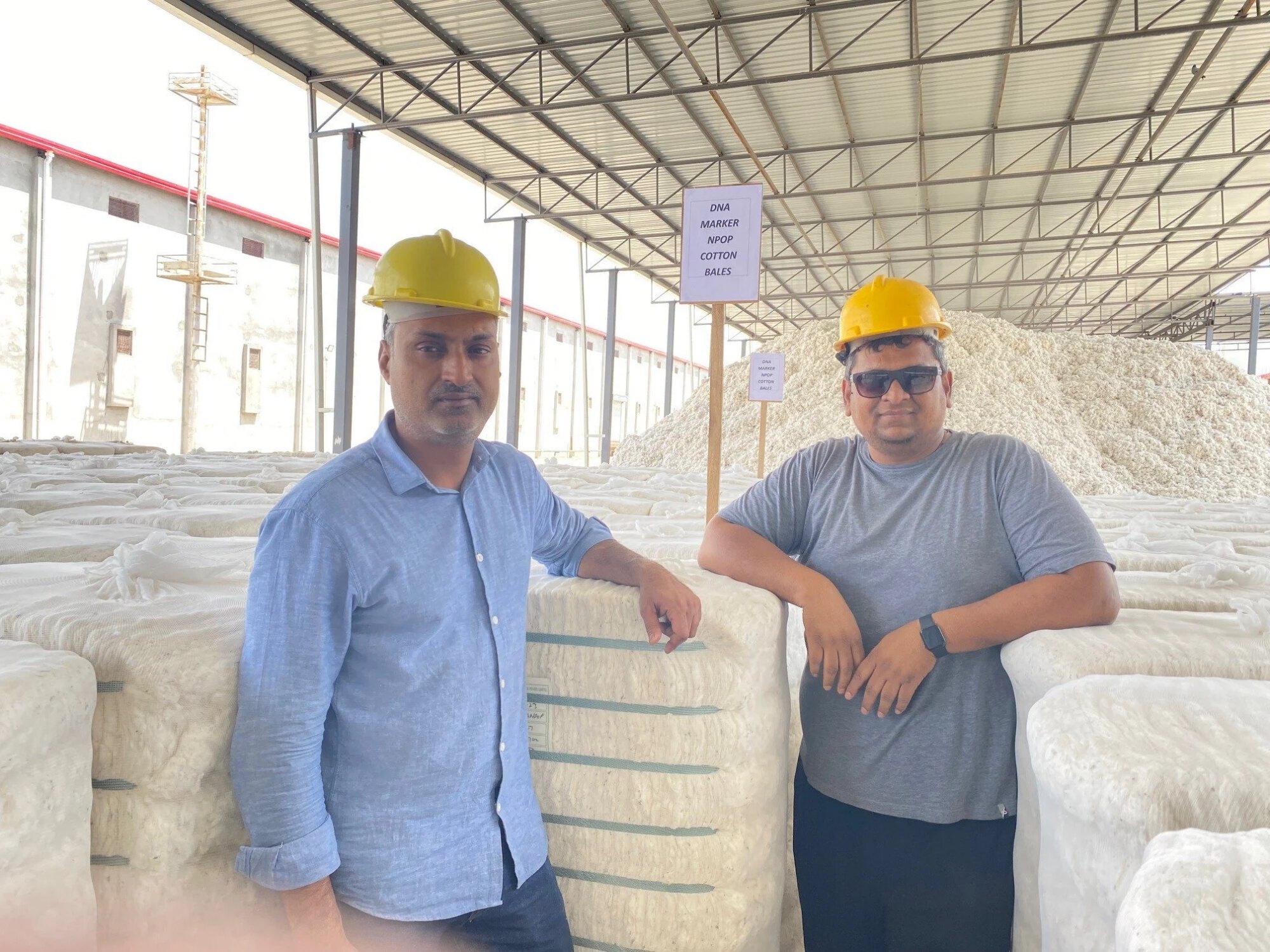 CottonConnect’s Associate Director – Technical Services, Pramod Sonune and Supply Chain Manager, Anil Kumar, with the first bale of cotton marked with DNA marker about to set off on its supply chain journey (May 2023)