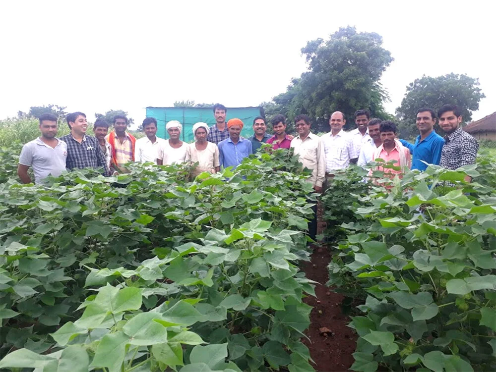 Farmers standing in a line smiling